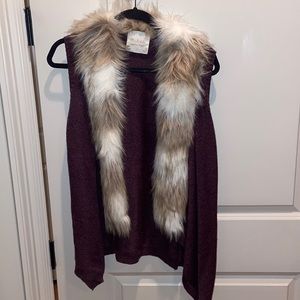 Alter’d state. Maroon sweater vest with fur around collar. Size large.